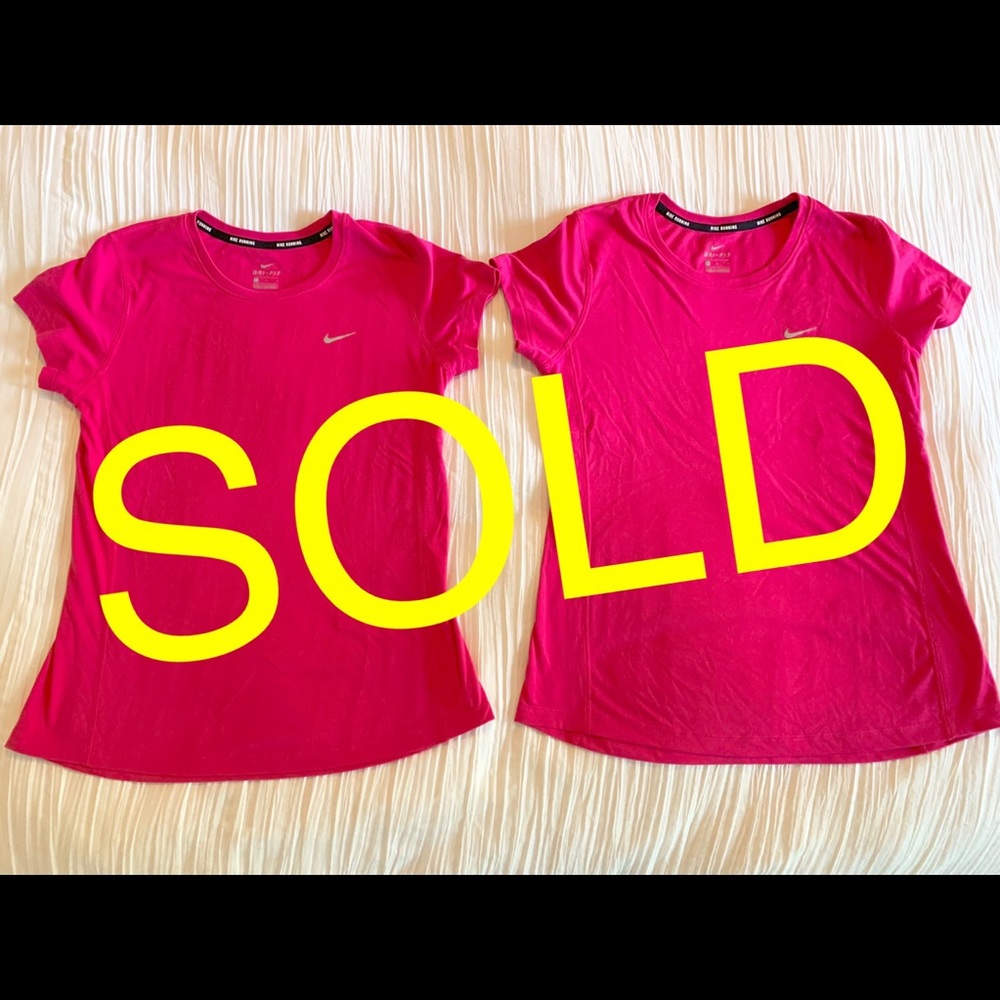 Two Nike women’s miler tops